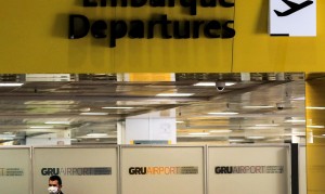 A worker, wearing a protective face mask, is seen at Guarulhos International Airport amid fears of coronavirus disease (COVID-19) in Guarulhos, Sao Paulo state, BraziI, April 1, 2020. REUTERS/Roosevelt Cassio
